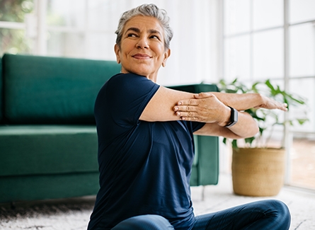Woman stretching at home