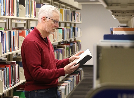 Scott Curtis reading a book
